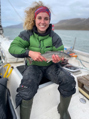 Woman with with migratory Arctic charr