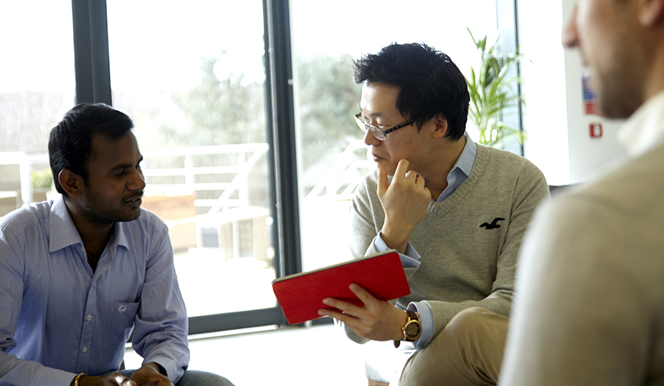 People in conversation in a breakout area