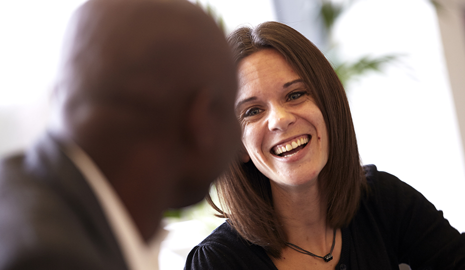 TPeople talking and laughing in a breakout space