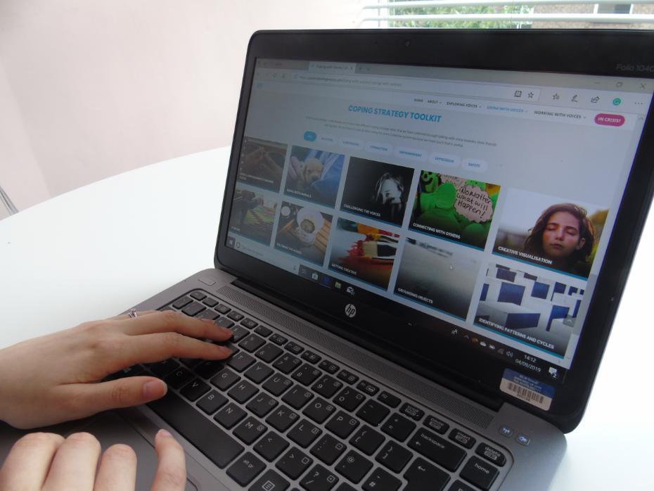 TClose up of a woman working on a laptop