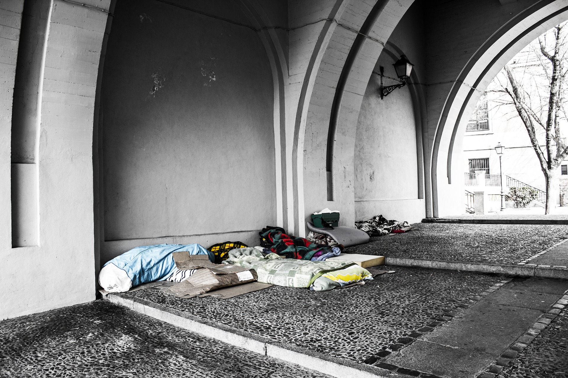 Homeless beds under an archway