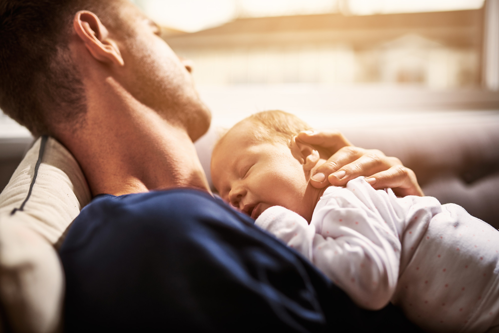 Parent and sleeping baby