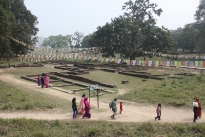 People walking through the tentative World Heritage Site of Tilaurakot in Nepal