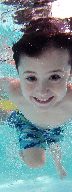 A boy swimming underwater