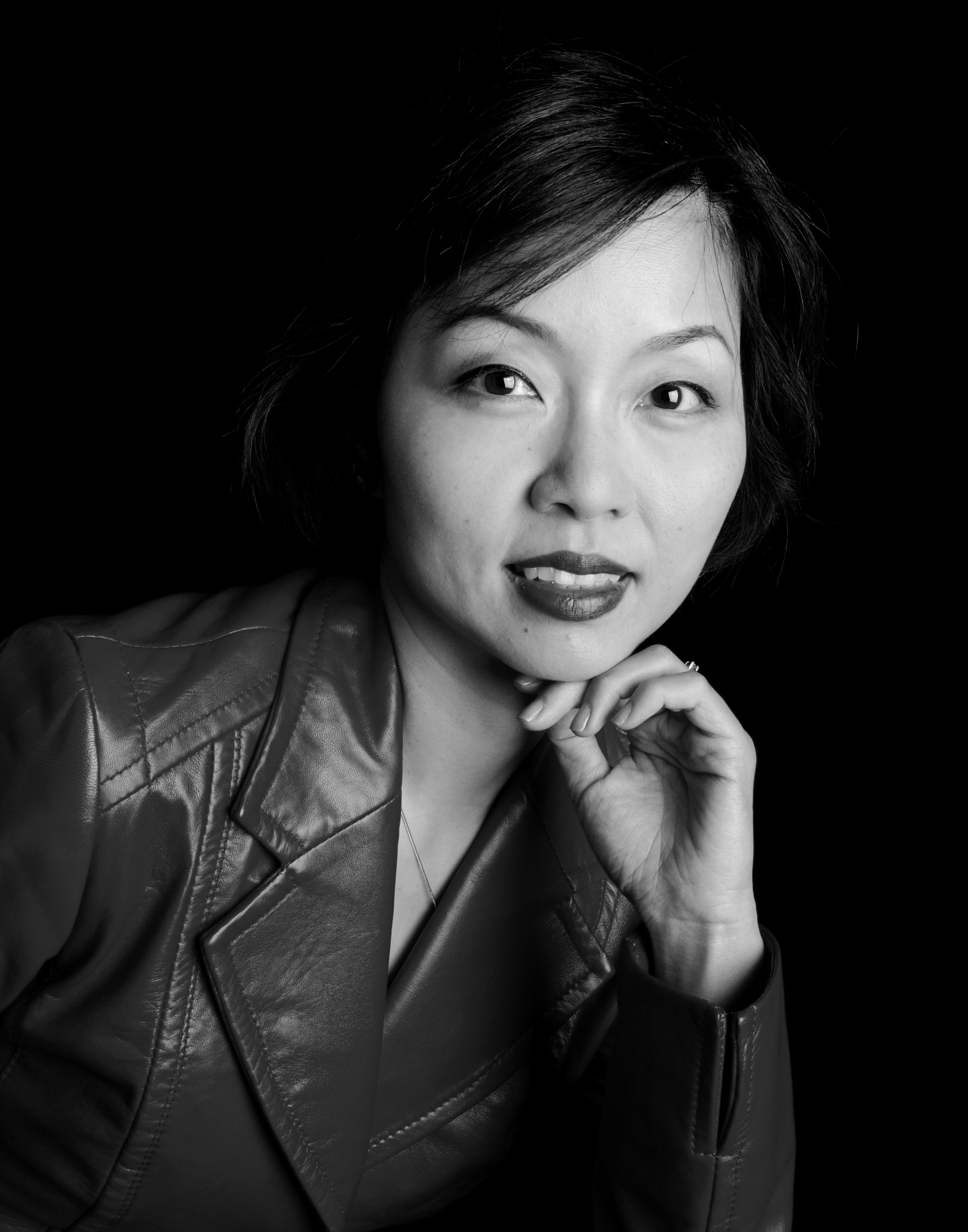 Black and white photo of a smiling woman