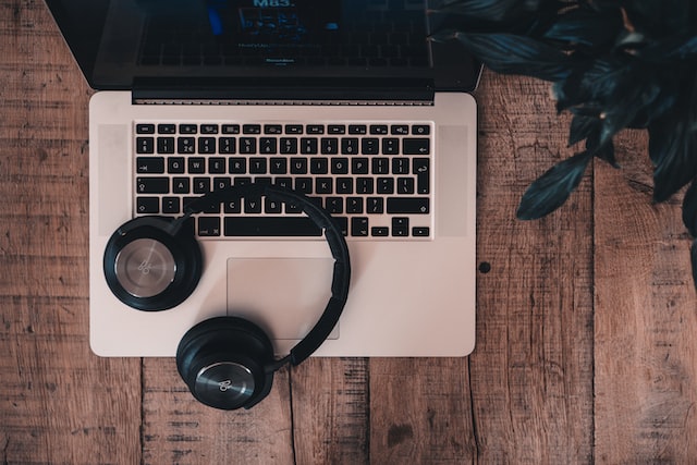 A pair of headphones on a laptop