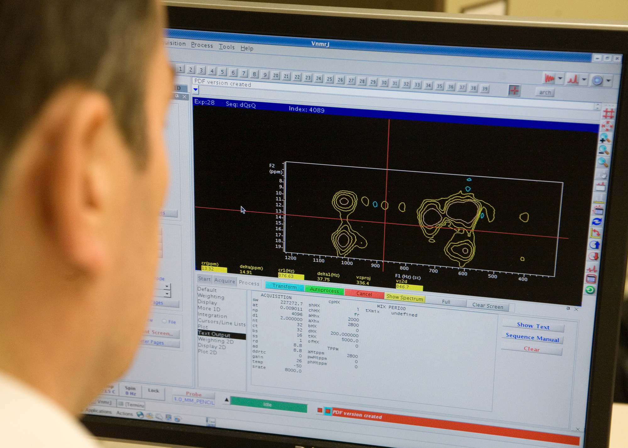 A man on a computer conducting research on solid state nuclear magnetic resonance