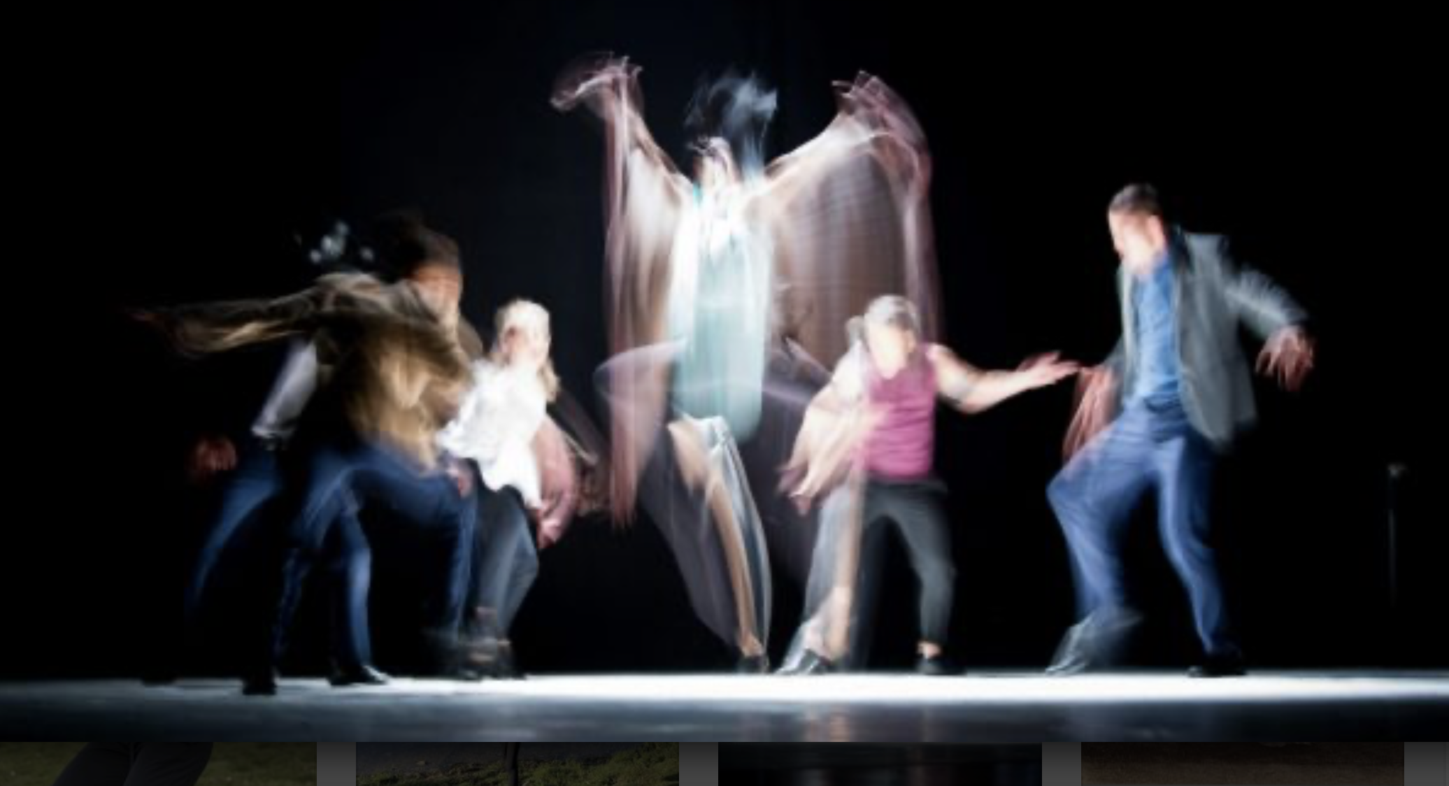 A blurred collection of figures dancing