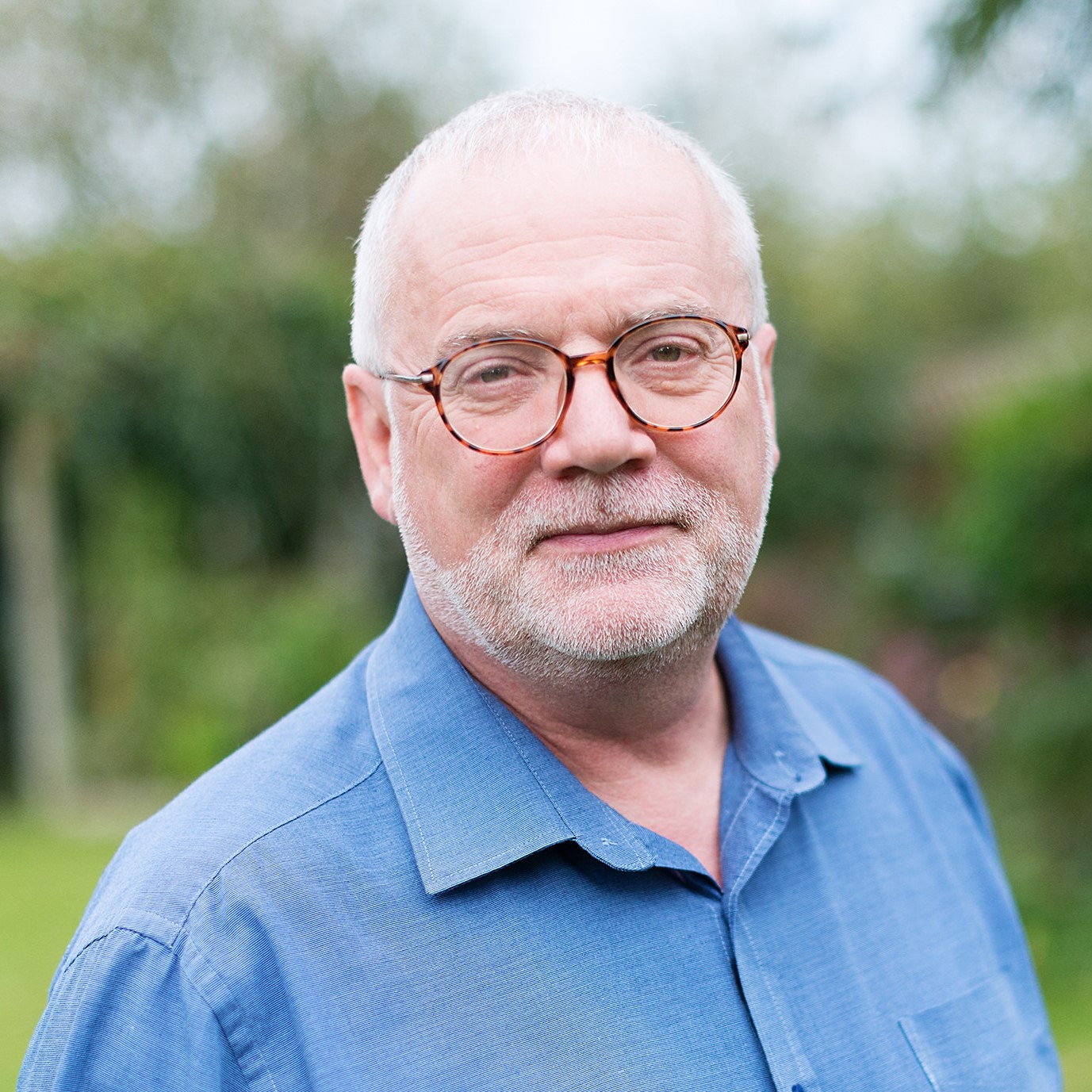 A white man with glasses and a beard