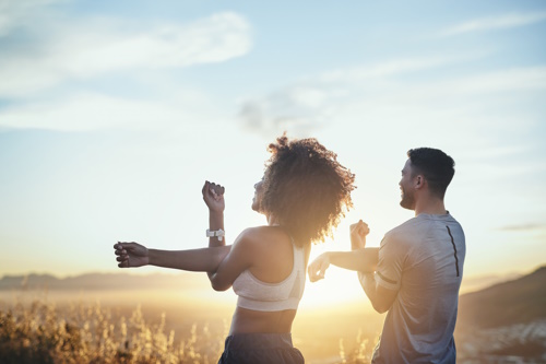 TPeople stretching yoga stetching outdoors_courtesy of iStock