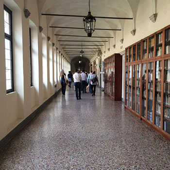 A group of people walking in a corridor