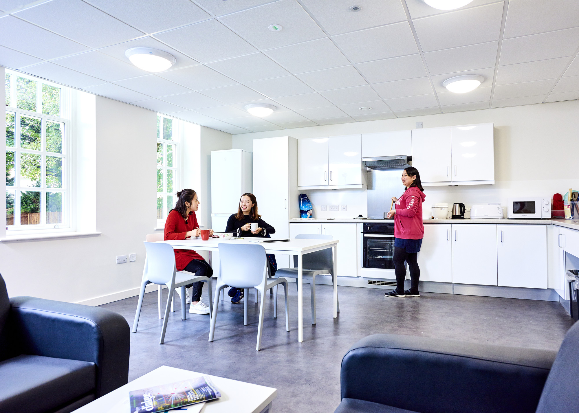 Students socialising in a kitchen at Ustinov College