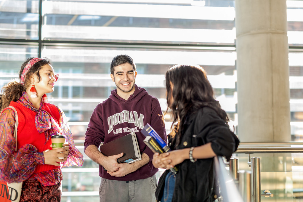 Three students talking