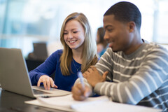 Students working together on laptop