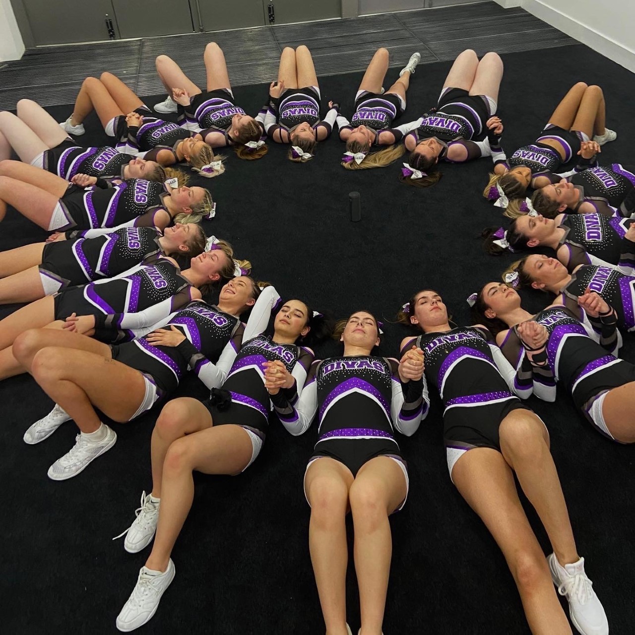 Cheer team lying down