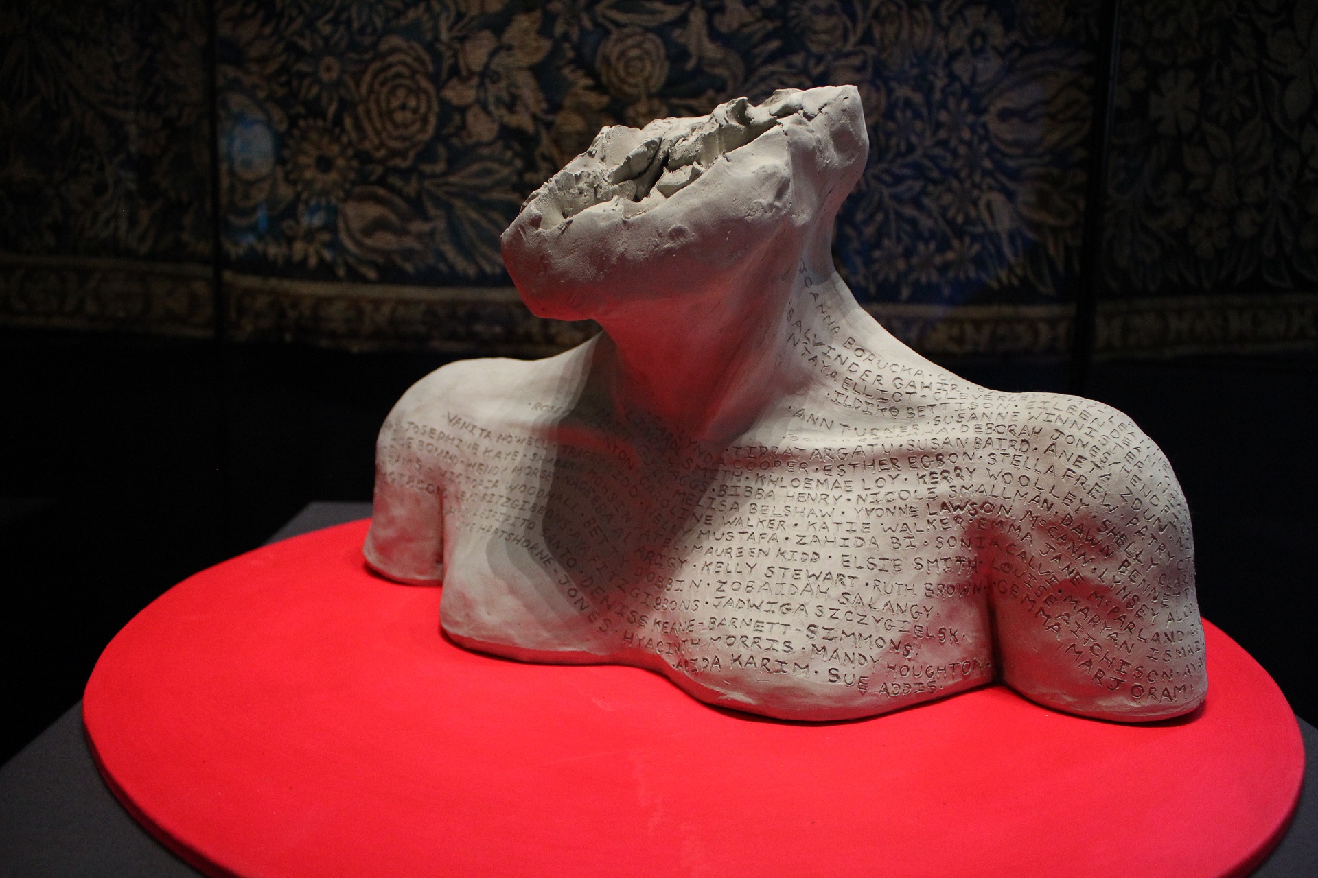 A photograph of the art installation in Durham Castle, which included a clay bust engraved with the names of 118 women who have lost their lives at the hands of men.