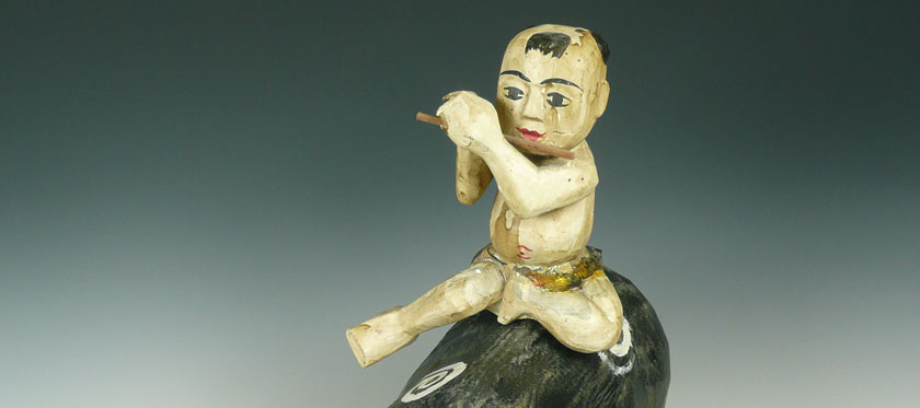 Vietnam boy wood carving