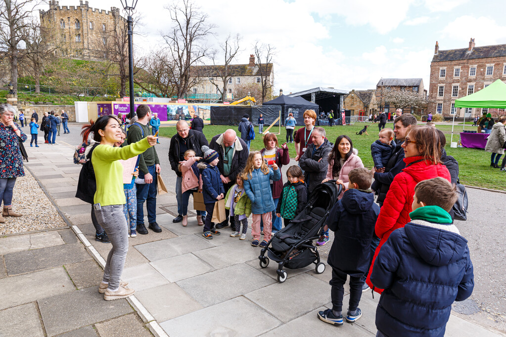 A Durham World Heritage Site Youth Ambassador giving a family friendly tour for World heritage Site Day 2023