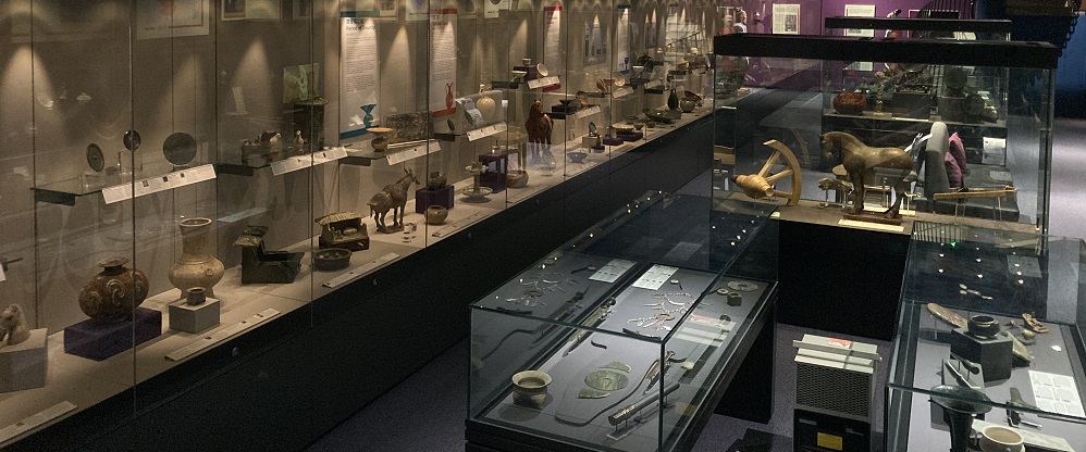museum display cases filled with Chinese objects